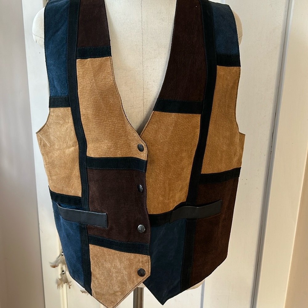 Leather patchwork vest. Very cool 70’s vibe!